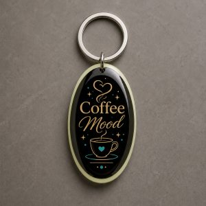Coffee Mood, tasse de café, un cœur et des détails graphiques dorés, porte-clés photoluminescent en lumière naturelle